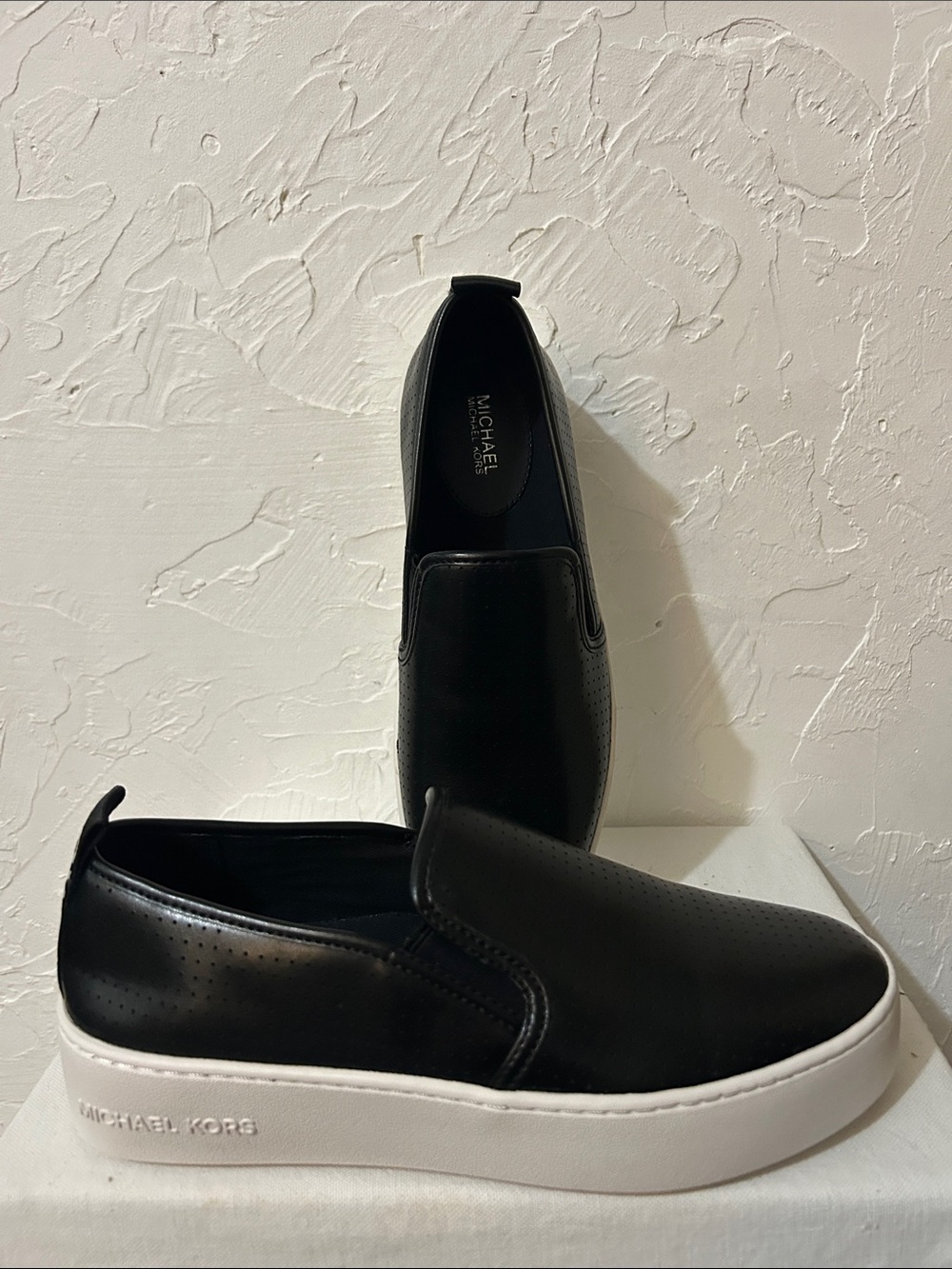 Michael Kors Black Leather Tessie Slip-On Sneakers/White Platform
S-7
Like New